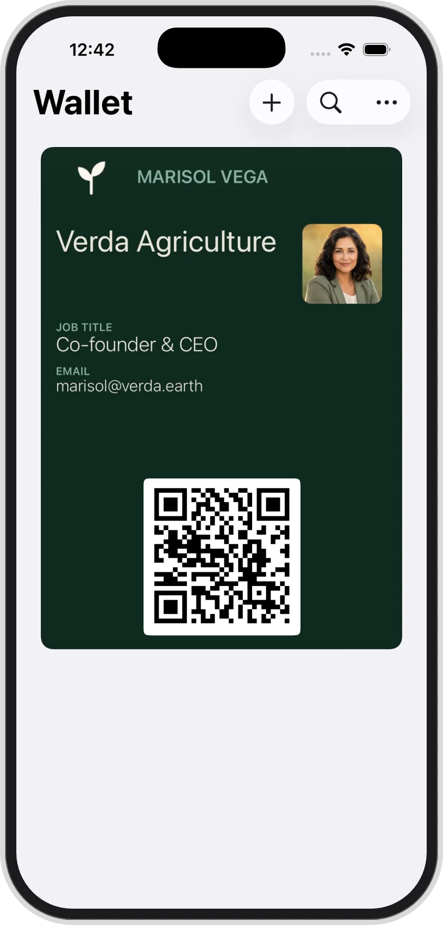 A team member's branded pass in Apple Wallet, shown on a phone